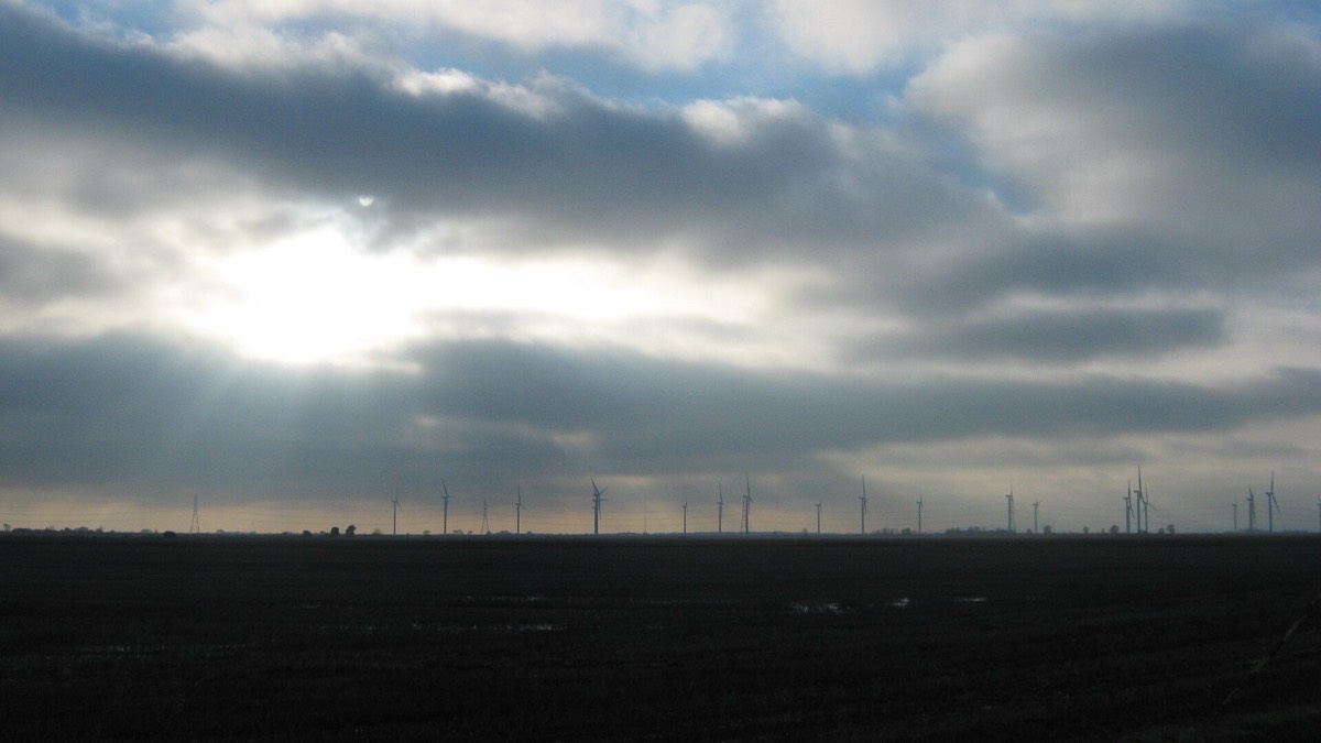 Winter sun and cloud over Little Cheyne Court Wind Farm on Romney Marsh